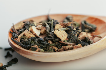 Fototapeta na wymiar Dried tea leaves close up on white background