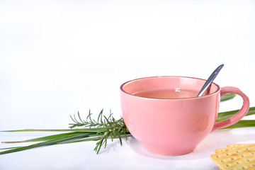 green tea with lemon balm and rosemary on white background