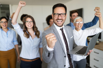 Group of successful business people in office
