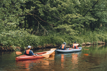 Fototapeta na wymiar Canoeing on the forest river.