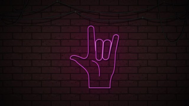 hand rock and roll neon blink on dark brick wall