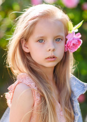 Fototapeta premium portrait of little girl outdoors in summer