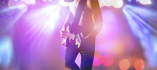 Obraz na płótnie Canvas Rock star on the main stage music festival.