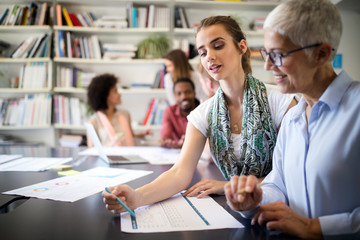 Cheerful coworkers in office during company meeting