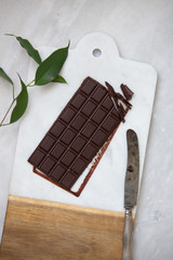 Dark chocolate on marble background with copy space