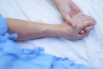 Holding Touching hands Asian senior or elderly old lady woman patient with love, care, helping,...