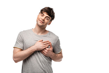 cheerful handsome man showing love gesture while looking at camera isolated on white