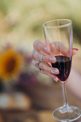 girl holding a glass of red champagne