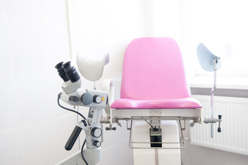 Fototapeta na wymiar Gynecological chair with colposcope in the clinic