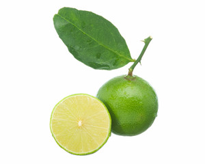 Lime and being sliced ​​with branches and leaves isolated on white background.