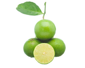 Lime and being sliced ​​with branches and leaves isolated on white background.