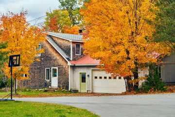 Driveway at suburban neighborhood. Autumn day in Maine, USA.