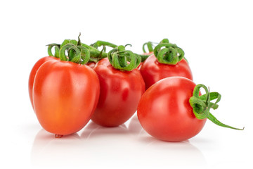 Group of four whole fresh red tomato cherry isolated on white background