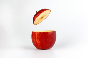 Health Red Cut Apple floating top slice juice drink idea concept on white background