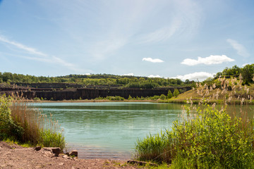Fototapeta na wymiar Scenic view of lake in an old quarry against sky