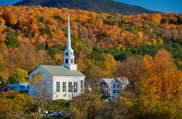 Iconic New England church in Stowe town at autumn in Vermont, USA
