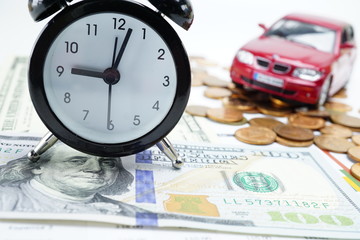 Alarm clock on US dollar banknotes for car loan :  Banking Account, Investment Analytic research data economy, trading, Business company concept.