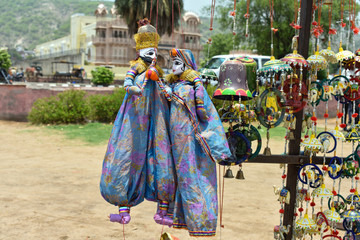 Colorful Rajasthan puppets hanging in the shop of Jaipur, India