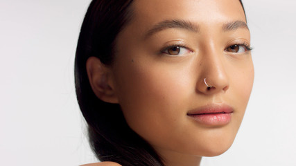 closeup portrait of mixed race model with ideal skin no makeup natural makeup. Korean mixed race...