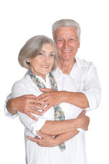 Portrait of happy senior couple on white background