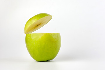 Healthy Green Cut Apple floating top slice juice drink idea concept on white background