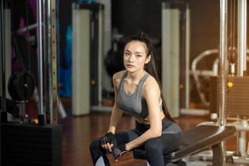 Fototapeta na wymiar sporty girl training in gym