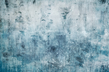 Splattered blue paint on a canvas, grungy background or texture