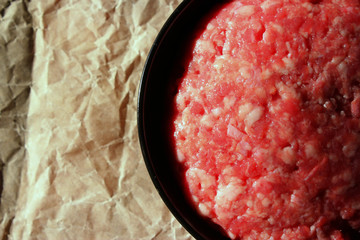 raw minced meat in a bowl top view copy space