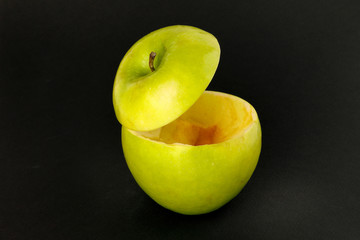 Healthy Green Cut Apple floating top slice juice drink idea concept on black background