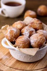 Tasty Homemade Cottage Cheese Donuts in Sugar Powder Wooden Background Donuts