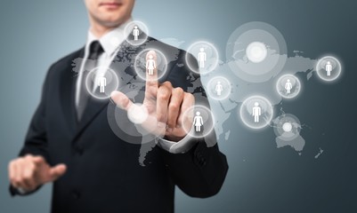 Businessman and internet and virtual reality concept - businessman pressing button on virtual...