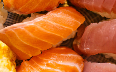 Homemade sushi generously topped with salmon