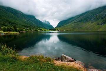 Tranquil landscape with beautiful lake and reflection in More og Romsdal County, Norway