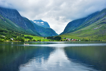 Tranquil landscape with beautiful lake and reflection in More og Romsdal County, Norway