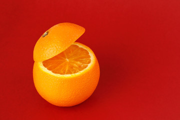Healthy Orange Cut floating top slice juice drink idea concept on red background