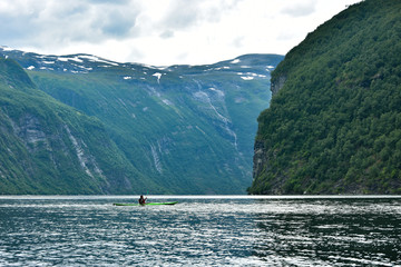 Adventure with kayak at Geirangerfjord , stunning natural masterpiece included in UNESCO World Heritage , Sunnmore region, Norway