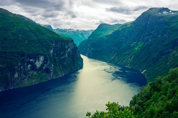 Fototapeta na wymiar The Geirangerfjord in Sunnmore region, Norway, one of the most beautiful fjords in the world, included on the UNESCO World Heritage. View from above. 