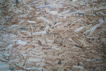 Plywood board Abstract background. Texture of plywood from large wood chips.
