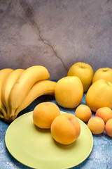 view of several ripe yellow and orange fruits