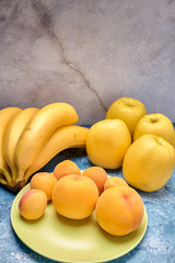 view of several ripe yellow and orange fruits