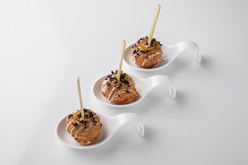 Сanapes meatballs. Beautifully decorated catering banquet menu. Food snacks and appetizers for buffet. Isolated on white background