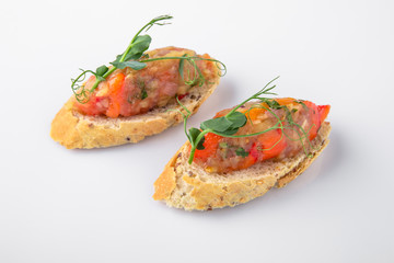 Canape mini bruskety sandwiches with fresh and steamed vegetables. Beautifully decorated catering banquet menu. Food snacks and appetizers for buffet. Isolated on white background