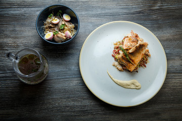 top view on three restaurant dish served on wooden table