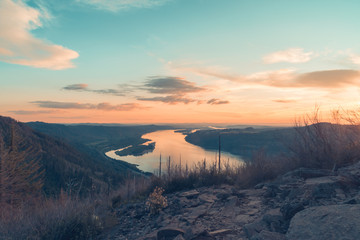 Orange and blue toned golden hour sunset over majestic view of the Columbia River Gorge, Oregon, Pacific Northwest United States