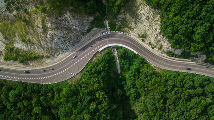 Aerial view from drone - winding road from the high mountain pass in Sochi, Russia.