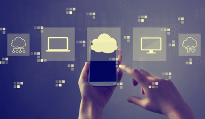 Cloud computing with person holding a white smartphone