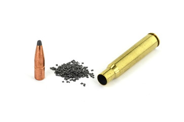 A rifle bullet, empty shell on white background. Hunting ammunition isolated on white.