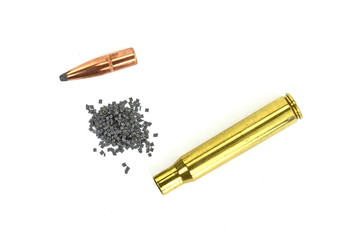 A rifle bullet, empty shell on white background. Hunting ammunition isolated on white.