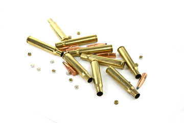 A rifle bullet, empty shell on white background. Hunting ammunition isolated on white.