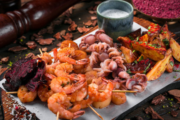 dish of seafood set on wooden table